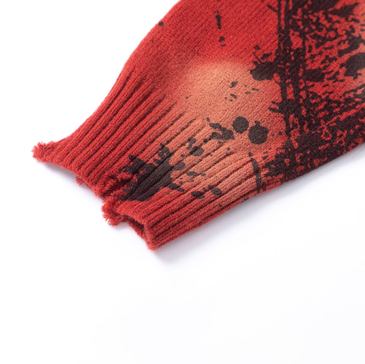 Distressed Red Knit A crewneck sweater with black paint splatter and frayed edges