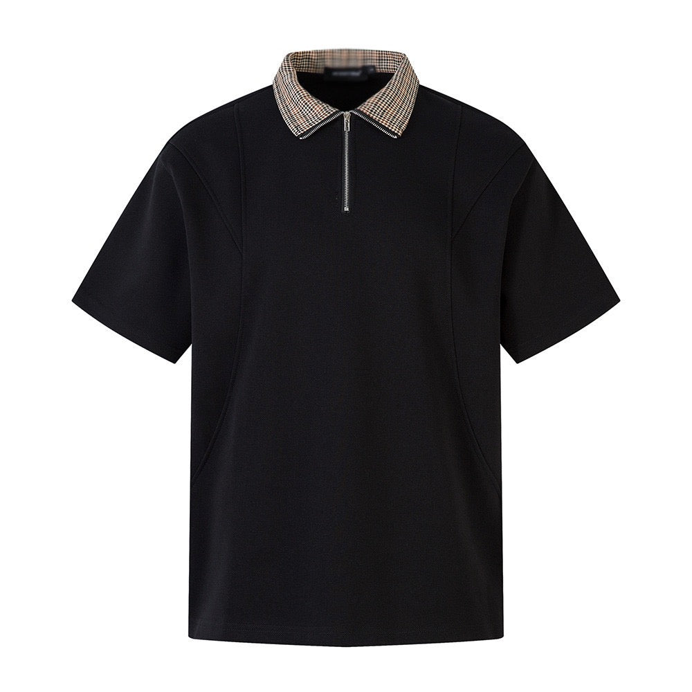 Short-sleeved black half-zip polo shirt with check-patterned collar.