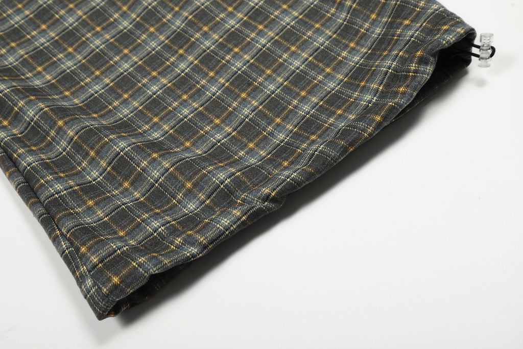 Plaid Trousers Relaxed-fit checkered pants with a brown elastic waistband