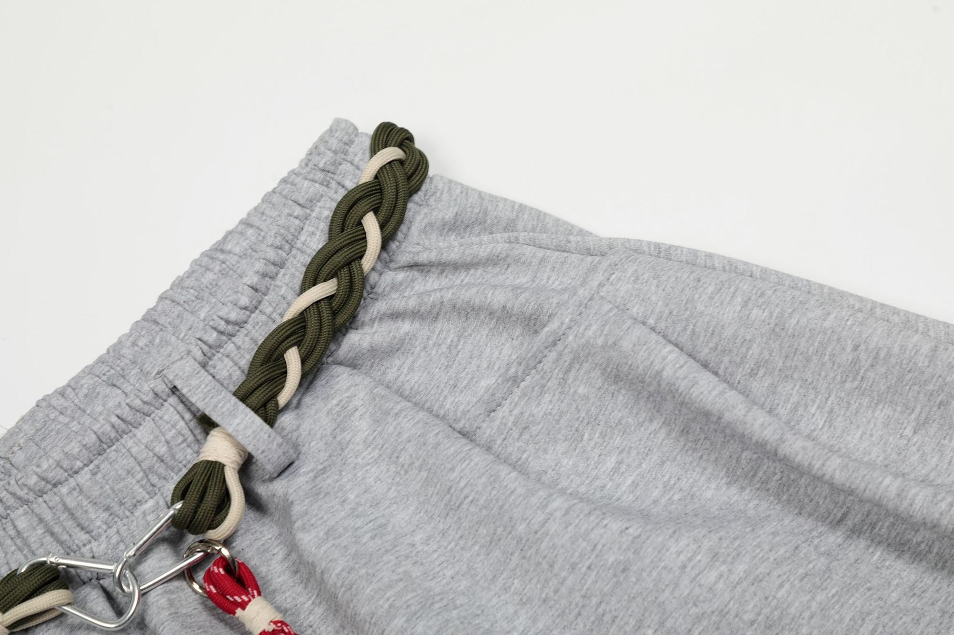 Baggy Sweatpants with unique braided rope belt with a red tassel