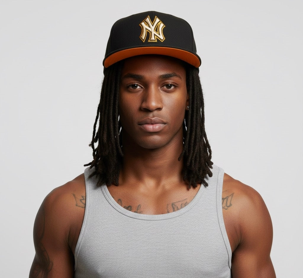 New Era 59Fifty x New York Yankees MLB fitted hat in black with a gold/yellow logo.