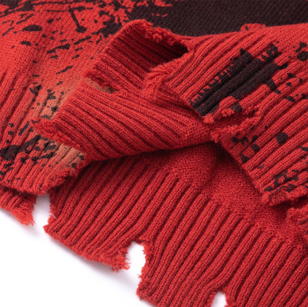 Distressed Red Knit A crewneck sweater with black paint splatter and frayed edges