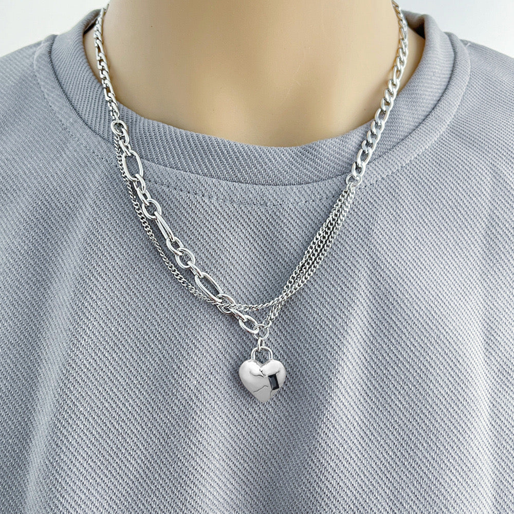 layered chain necklace with a puffy heart pendant