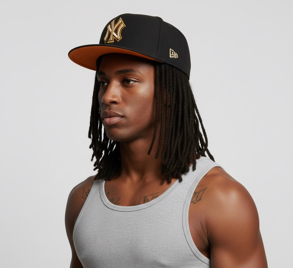 New Era 59Fifty x New York Yankees MLB fitted hat in black with a gold/yellow logo.