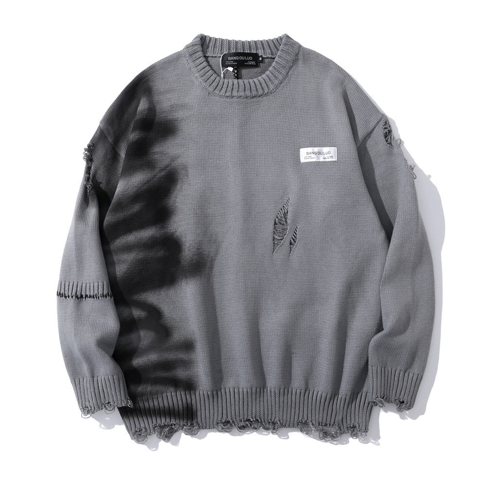 Ripped graffiti sweater