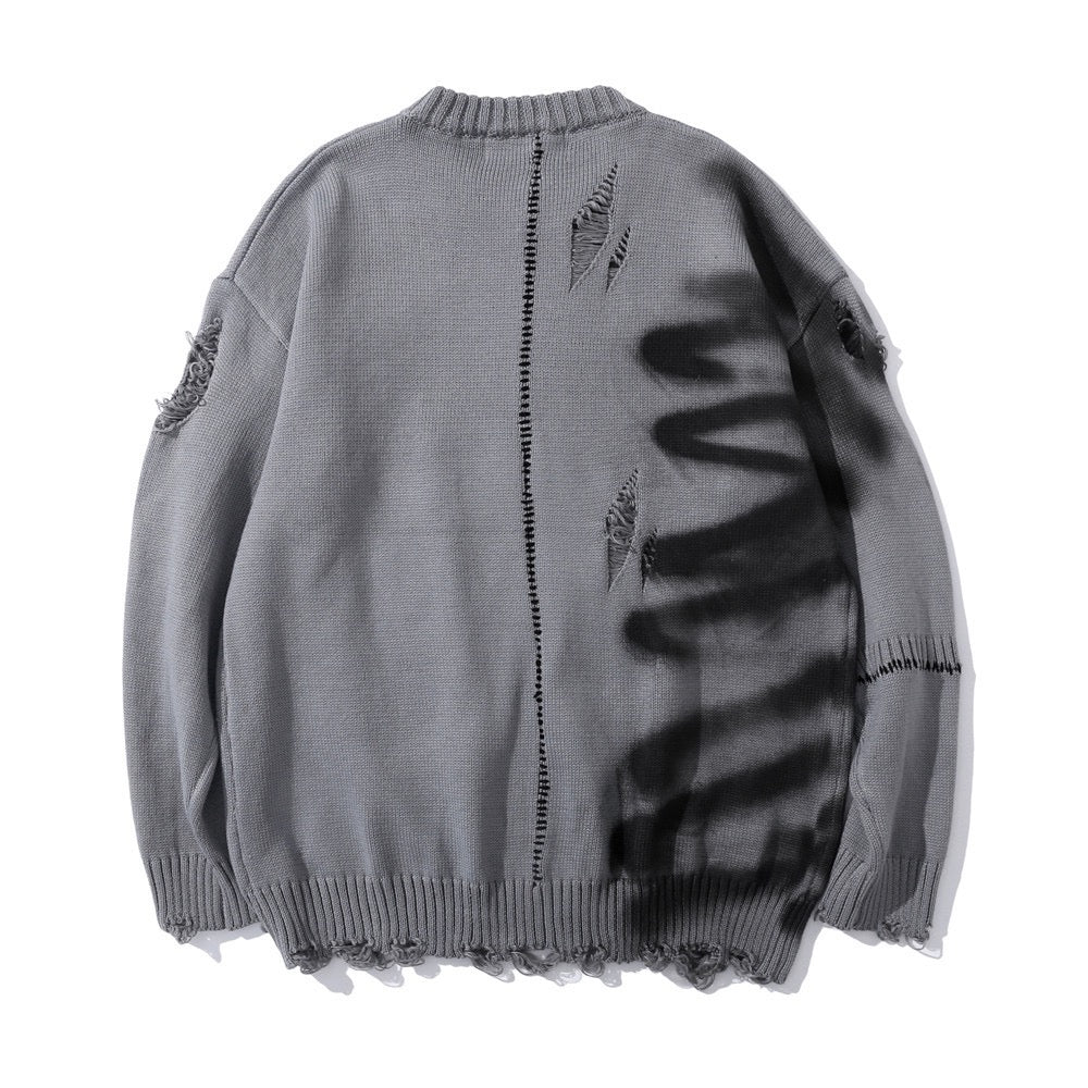 Ripped graffiti sweater